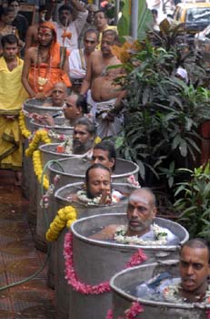 priests in barrels